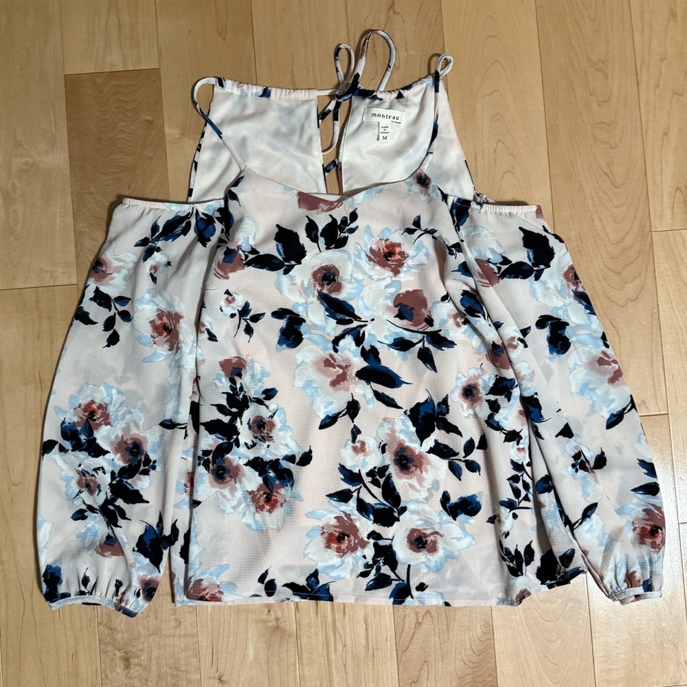 Long sleeve printed shirt with cut outs at shoulder.